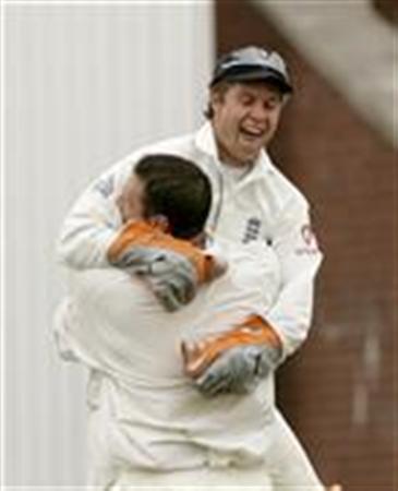 England players Jones and Harmison celebrate after dismissing Pakistan's Razzaq to clinch victory on the third day of their second test cricket match in Manchester 